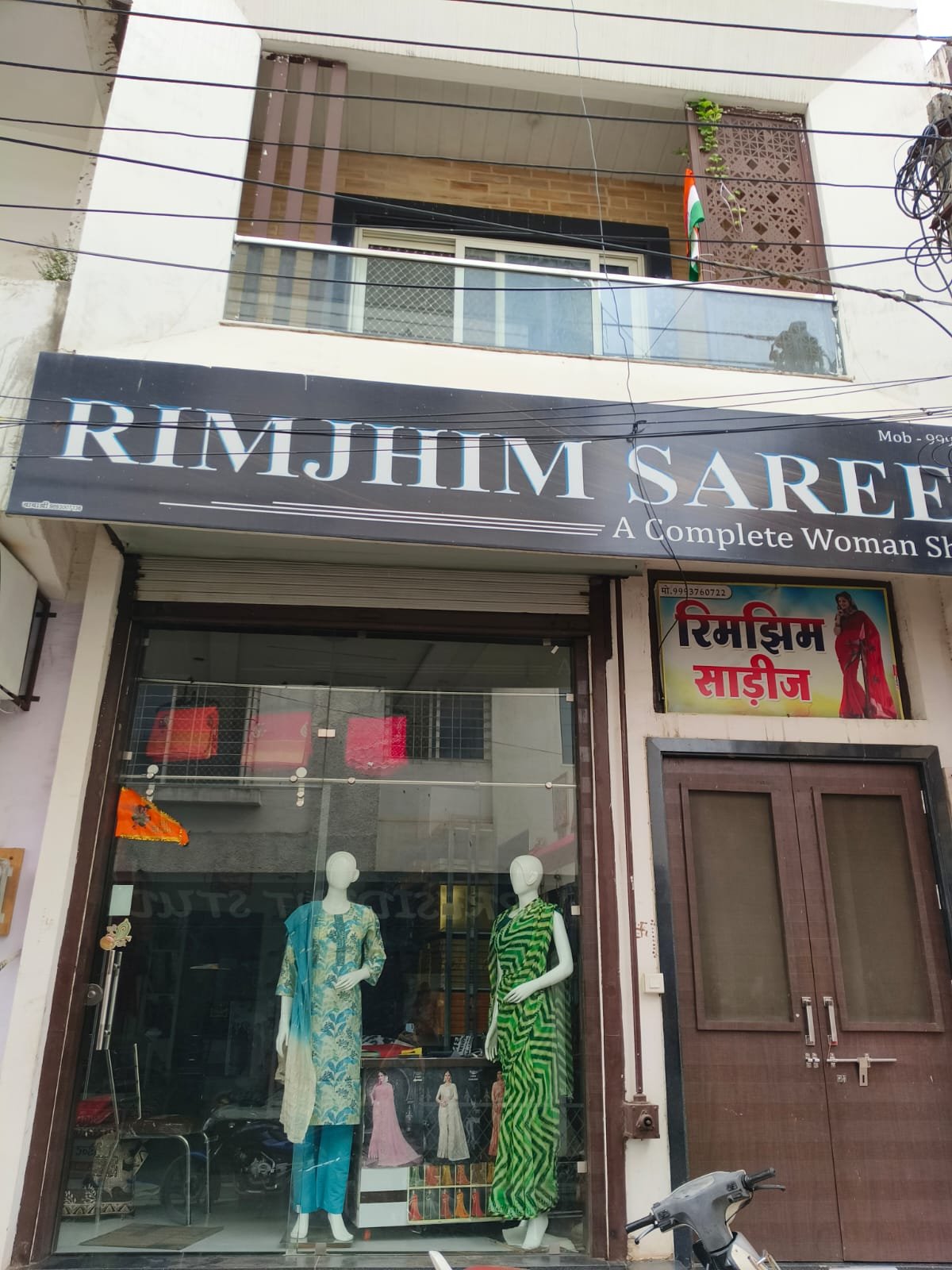 Rimjhim Sarees store interior — collection wall