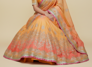 peach–orange dual tone bandhani lehenga choli with mirror work & gota patti border – festive wear
