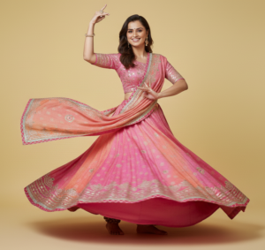 Pink–Peach Dual Tone Bandhani Lehenga Choli with Mirror Work & Gota Patti Border – Festive Wear pink–peach dual tone bandhani lehenga choli with mirror work & gota patti border – festive wear